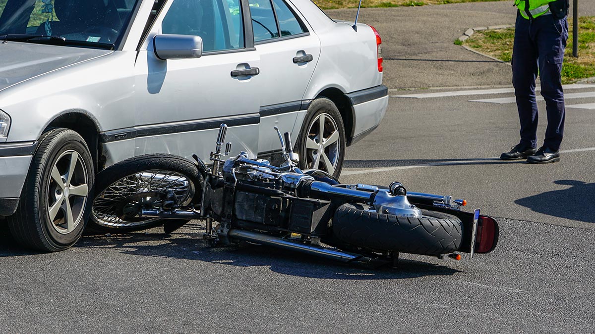 motorcycle and car accident with police officer